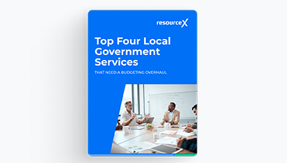 Cover image of the Top Four Local Government Services That Need a Budgeting Overhaul E-Book, Colleages collaborating in a conference room with whiteboard