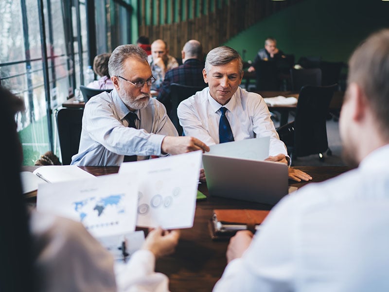 Politicians discussing business at a table