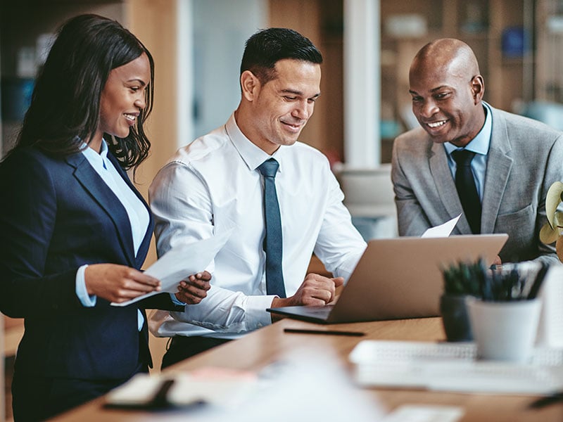 Diverse group of smiling businesspeople working in an office