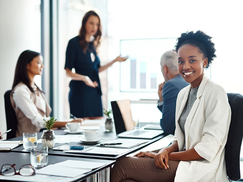 Businesspeople collaborating around a conference table