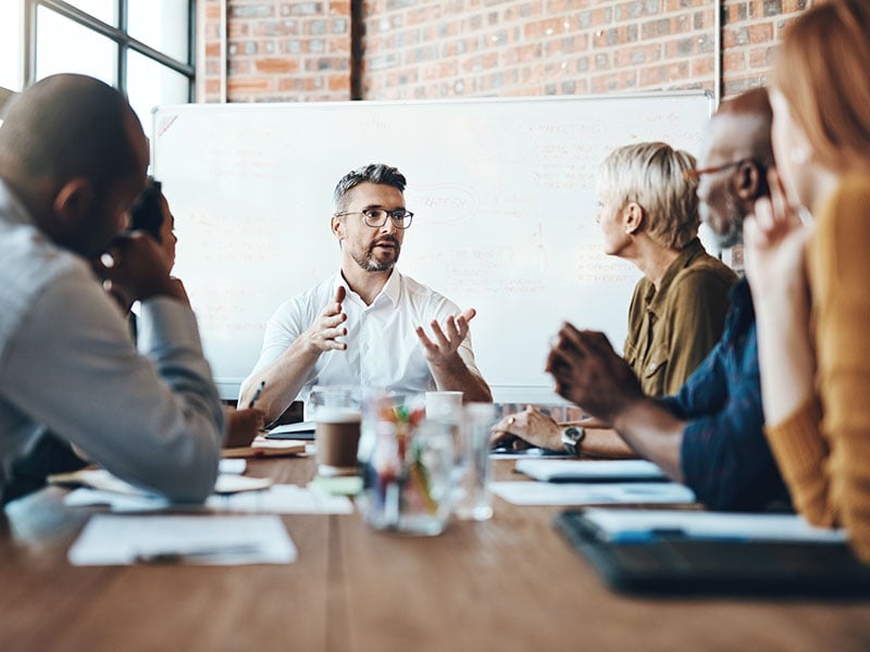 Businessman leading a meeting in a boardroom
