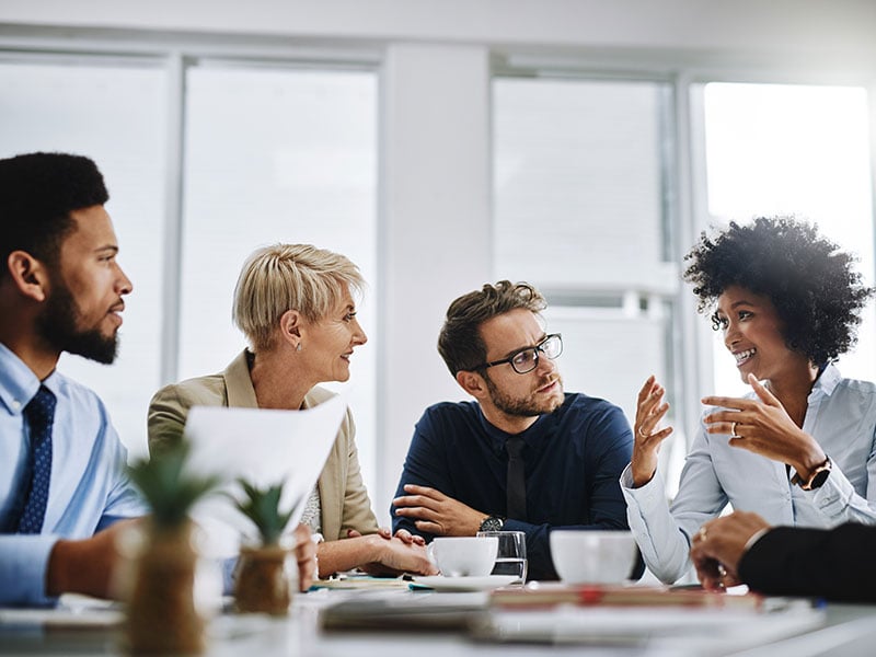 A group of businesspeople meeting in a conference room