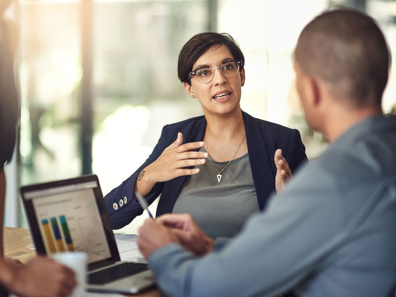 A business person leading a budgeting meeting