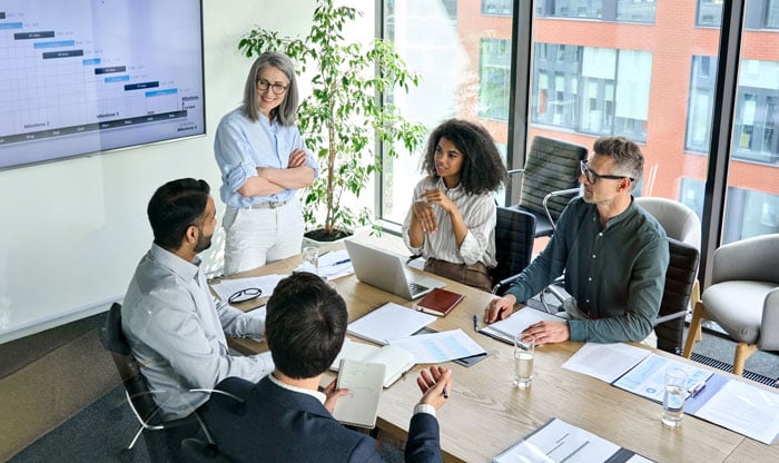 group of government employees meeting in conference room