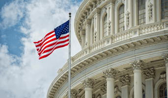 flag waving in front of the the capital building in DC - gfoa distinguished budget award