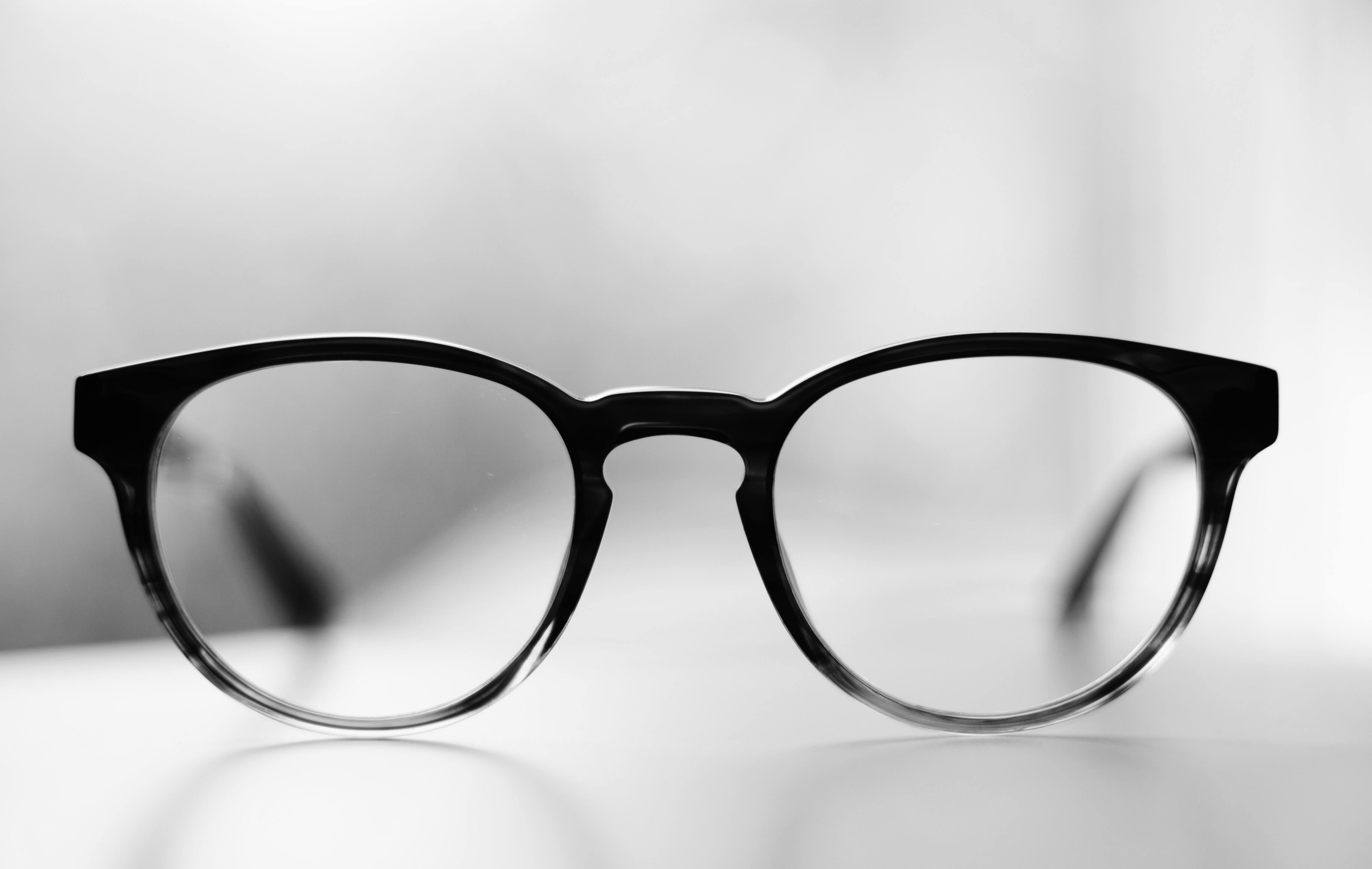 Black glasses representing an equity lens